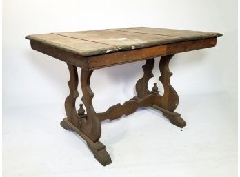 An Antique Oak Trestle Table