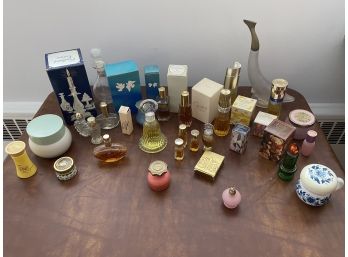 Collection Of Avon Fragrances And Collectible Bottles