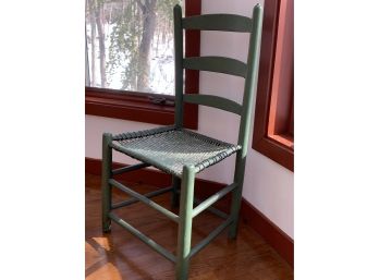 Small Green Chair With Natural Seat Which Is Painted Green