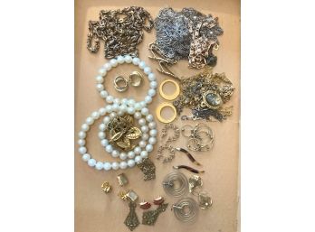 A Flat Full Of Various Metal Chains, Earrings & More