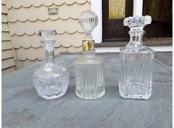 Three Tall Clear Glass Decanters