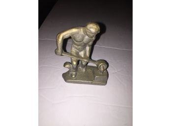 Sculpture Of A Iron Worker Smelting Metal