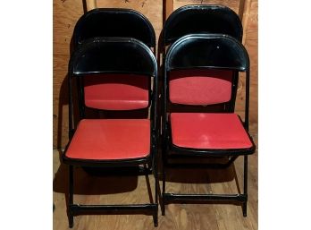 Four Black Metal Folding Chairs With Vinyl Seats