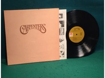Carpenters. Self-Titled On A&M Records. Stereo Vinyl Is Near Mint. Gatefold Jacket Is Very Good Plus.
