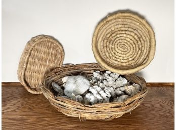 A Collection Of Baskets And Shells