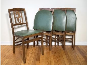 A Set Of 4 Vintage Folding Chairs In Green Vinyl