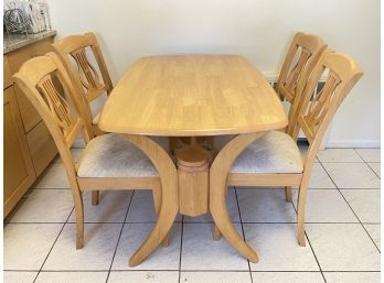 A Malaysian Export Oak Dining Table And Chairs