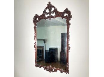 A Large, Ornately Carved Mahogany Mirror