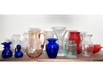 A Collection Of Colored Glass Vases