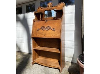 An Antique Oak Slant Front Larkin Desk