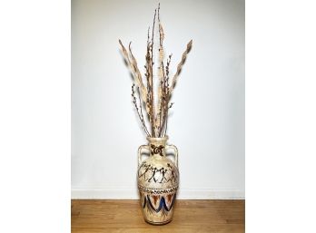 A Large Primitive Earthenware Vase And Dried Floral