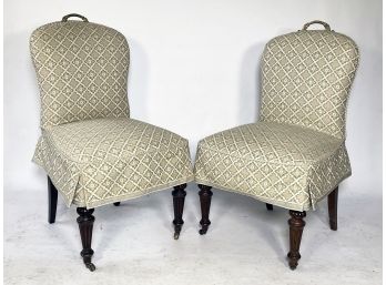 A Pair Of Slip-Covered Banquet Chairs With Brass Handles