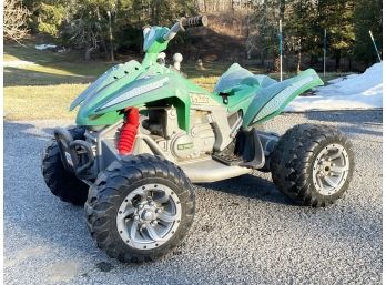 A Child's T-Rex 4 Wheeler Toy