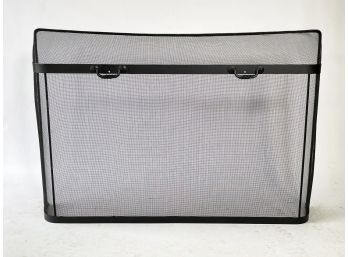 A Large Wrought Iron And Mesh Fireplace Screen