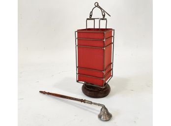 A Candle Lamp And Silver Candle Snuffer