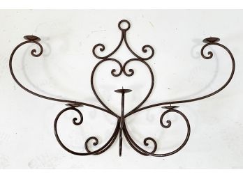 A Large Wrought Iron Wall Hanging Candle Holder