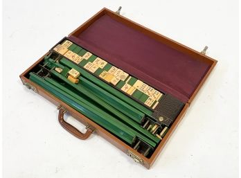 An Antique Mahjong Set With Bakelite Pieces In Leather Case