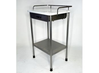 A Modern Industrial Brushed Steel And Enamel Table