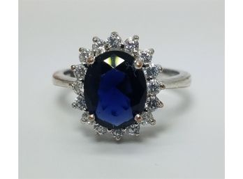 Vintage Size 7 Sterling Silver Ring With A Large Deep Blue Stone Surrounded By CZs