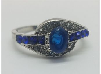 Lovely Silver Plated Size 9 Ring With Faux Blue Stones. Marked 925