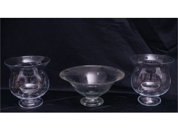 Two Hurricane Candle Holders And A Center Piece Bowl