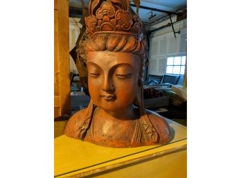 Red Buddah Bust Made From A Composite Material