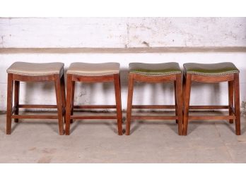 New Set Of Four Saddle Style Stools In Leather