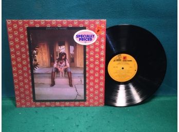 Emmylou Harris. Elite Hotel On Reprise Records. Vinyl Is Very Good. Jacket In Original Shrink Wrap Is NM.