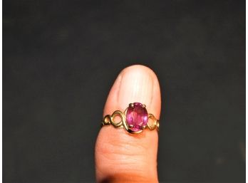 10 Kt Gold Little Girls Ring With Purple Cut Stone