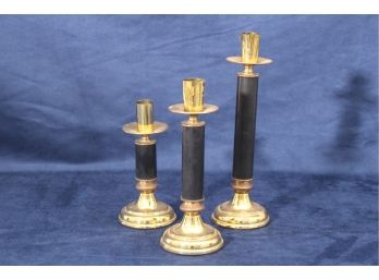 Three Gold Toned And Black Candle Stick Holders