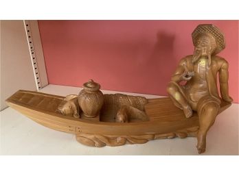 Carved Wood People In Boat