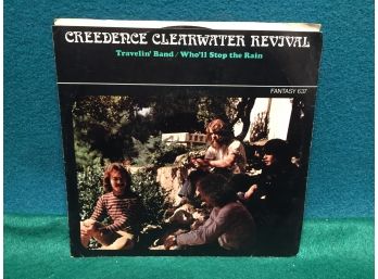 Creedence Clearwater Revival. Travelin' Band/Who'll Stop The Rain. Vintage 45 Rpm Record With Picture Sleeve.