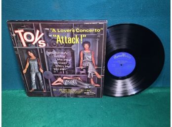 The Toys Sing 'A Lover's Concerto' And 'Attack' On DynoVoice Records Stereo. Vinyl Is Very Good. Jacket Is VG.