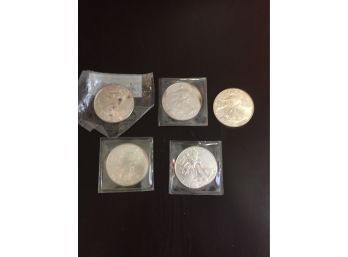 5 American Eagle Silver Dollars  2000,2002,2007, 2010,2014.