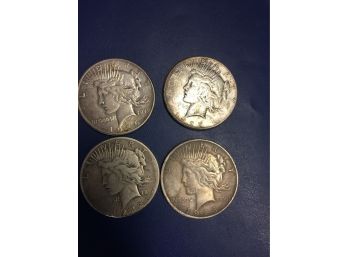 4 Peace Silver Dollars   22s, 23, 26s , 27s.