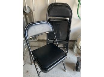 Five Black Metal Folding Chairs