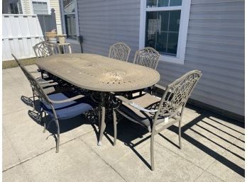 Cast Aluminum Oval Patio Table With Six Matching Arm Chairs