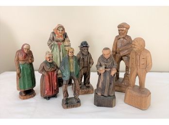 Two Antique Carved Wood Figures Of A Old Man And Woman  Along With Six Other Carved Wood Figures