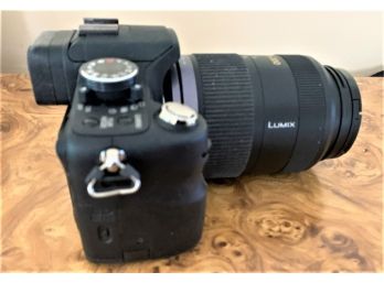 Lumix G1 Along With A Nikon Caring Cast Camera, Lens And Charger