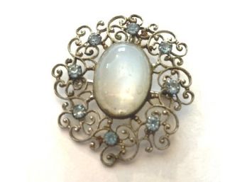 Sweet Silver Tone Pin/Pendant With Moonstone Sorrundedby Pale Blue Rhinestones, Pretty