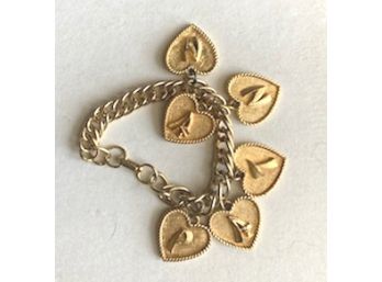 Heavy Gold Tone Bracelet With SIX Hearts