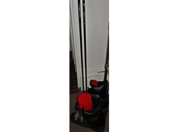 Pair Of Men's Ski Boots And Poles