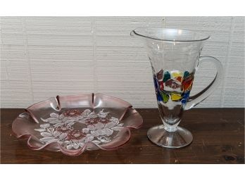 Art Glass Pitcher W Multicolored Design, Pink Decorative Plate W Ruffled Edge And Floral Leaf Design