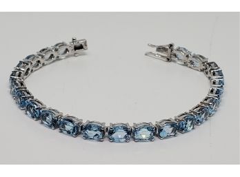 Amazing Blue Topaz, Rhodium Over Sterling Tennis Bracelet