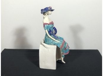 Porcelain Figurine Of Woman On A  By Sara Zach