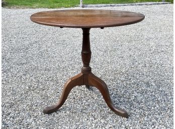 An Antique Oak Tilt Top Table