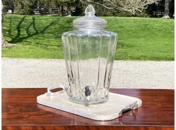 A Glass Drinks Vessel And Vintage Tray