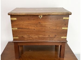 An Antique Indonesian Teak And Brass Footed Chest