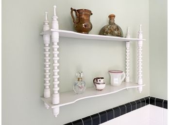 A Spool Style Curio Shelf And Contents