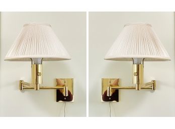 A Pair Of Brass Articulating Arm Sconces